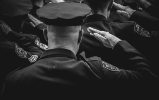 Police officers giving a salute