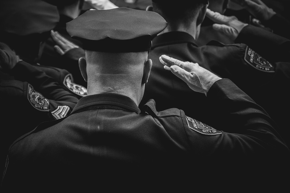Police officers giving a salute