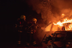 Two firefighters fighting fire