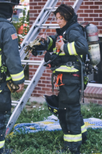 A smart and healthy woman firefighter on duty