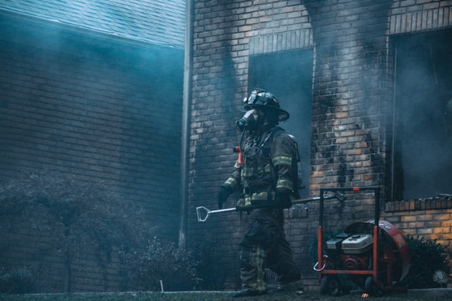 A firefighter on duty trying to extinguish the fire in the building
