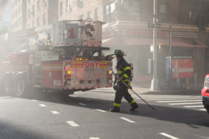A firefighter and an FDNY truck