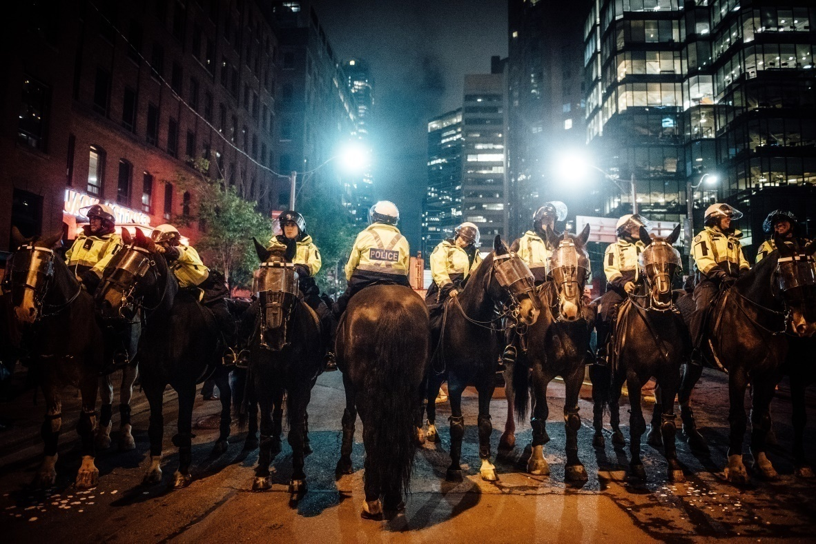 Police officers sitting on horses