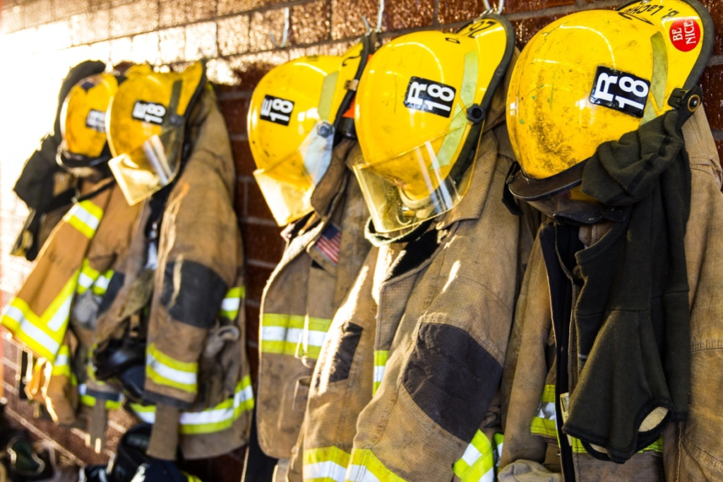 Firefighter apparel hanging on hooks