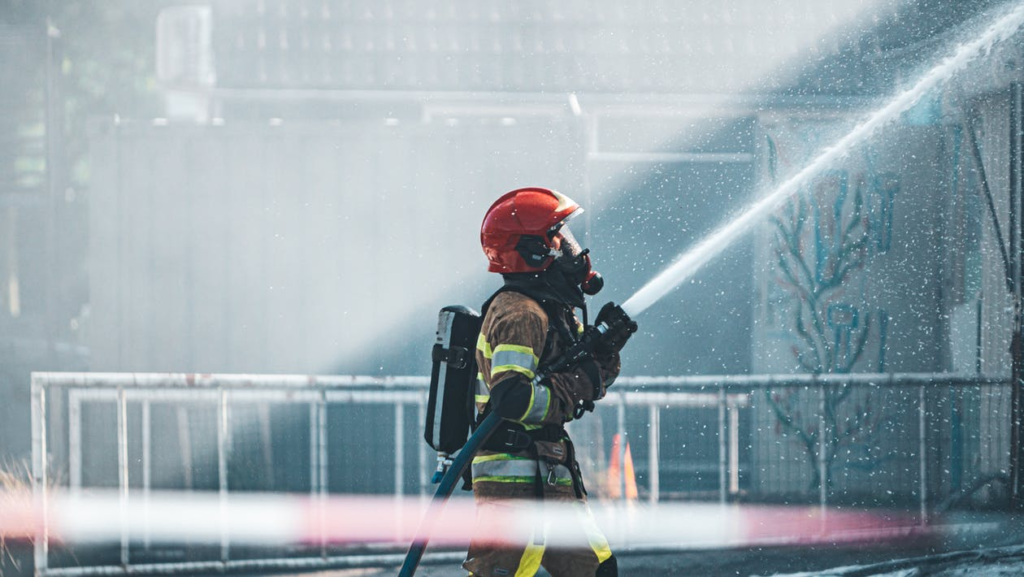 A firefighter trying to put out a fire