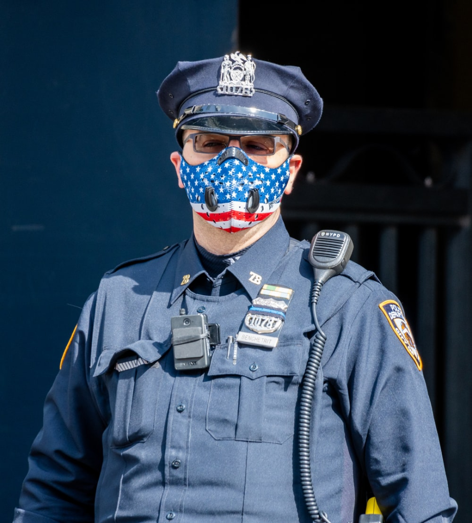An NYPD officer wearing a mask