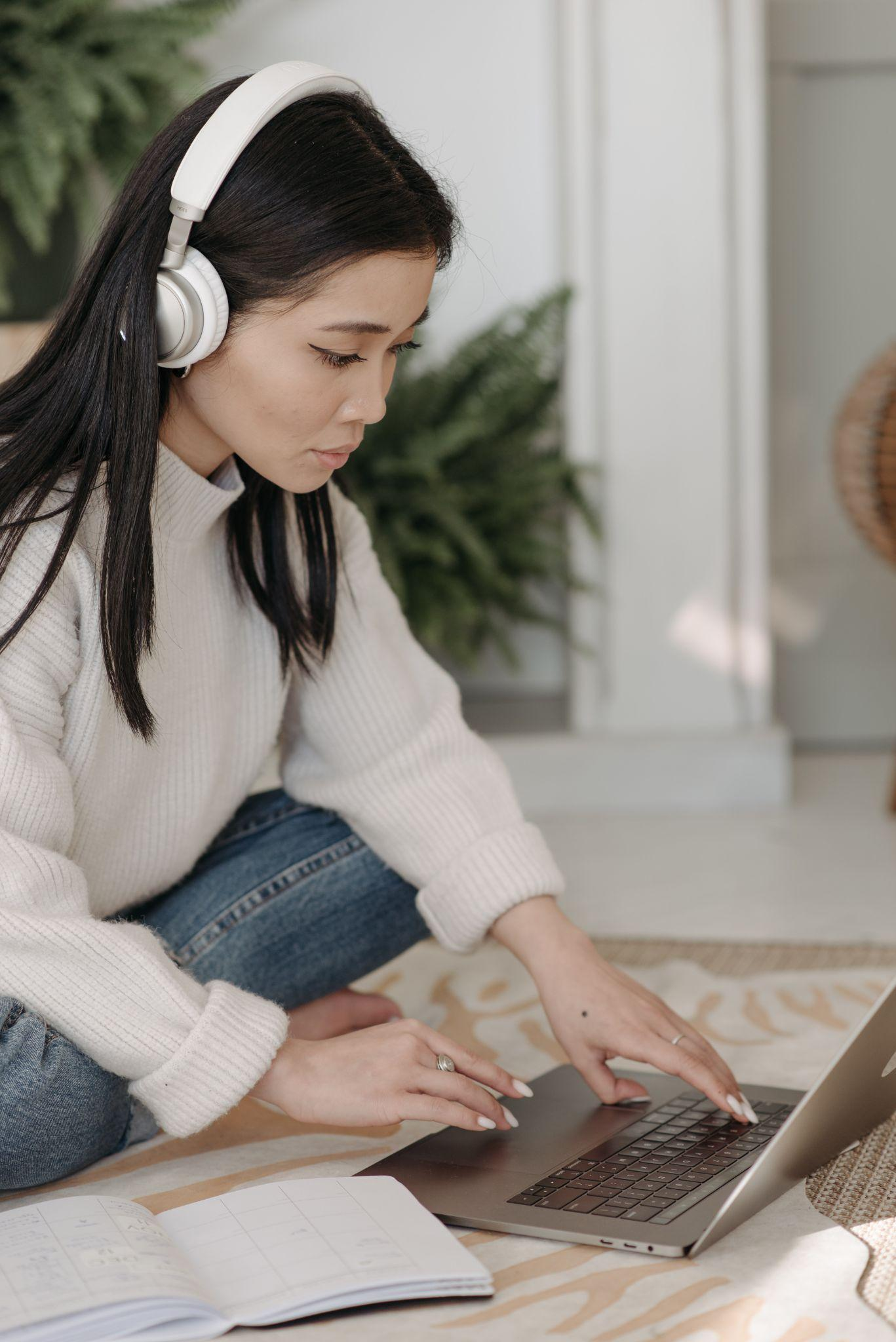 A girl listening to music while studying