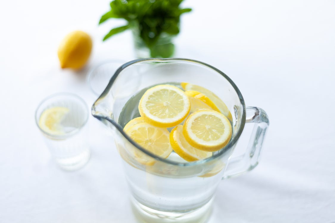 An image of a water jug with lemons